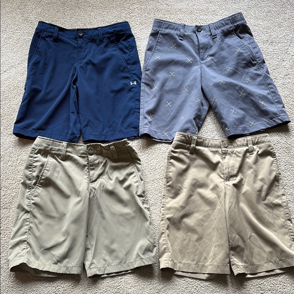 Four pairs of boys Under Armour shorts in very good condition. Size small/10